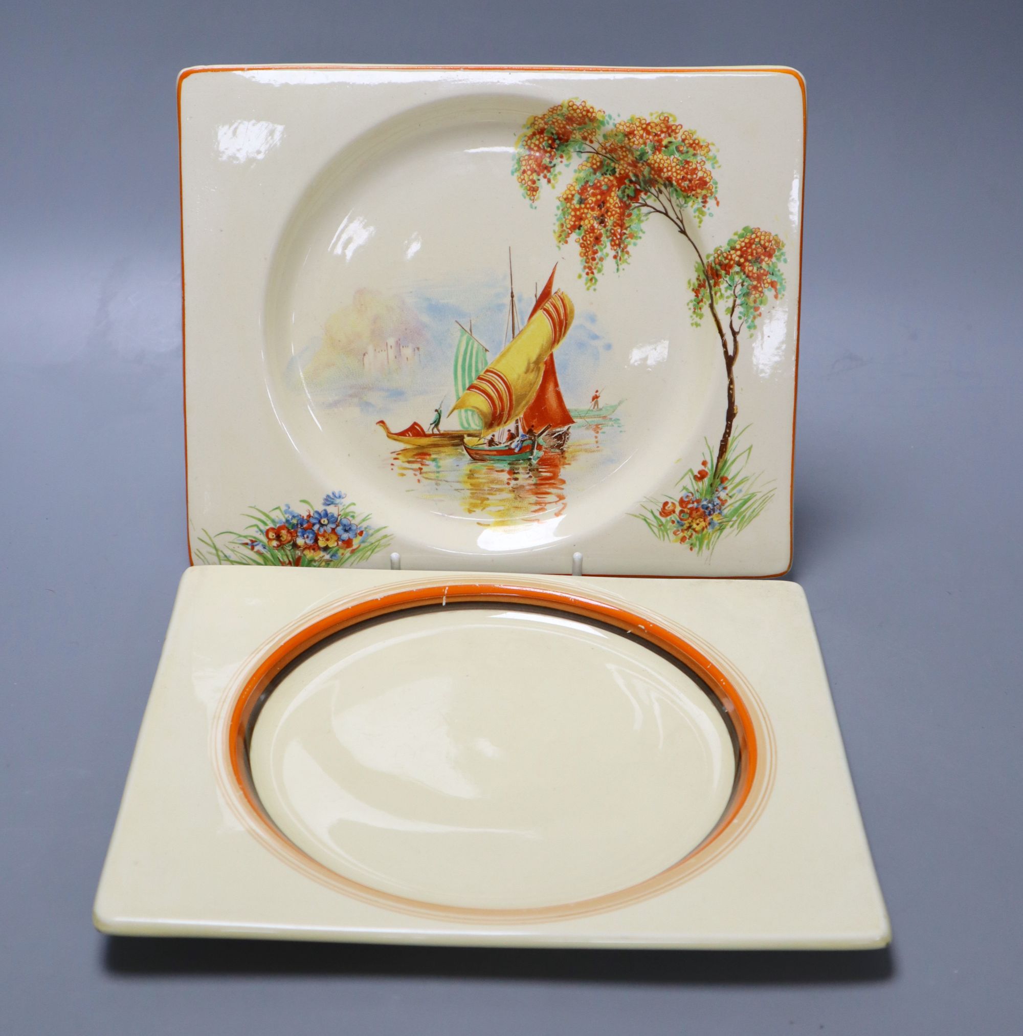 Two Clarice Cliff Biarritz shaped side plates, 19.5 x 23cm